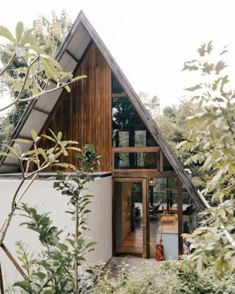 Sleek And Timeless: A Modern A-Frame Home Amidst Natural Landscape a-frame modern home