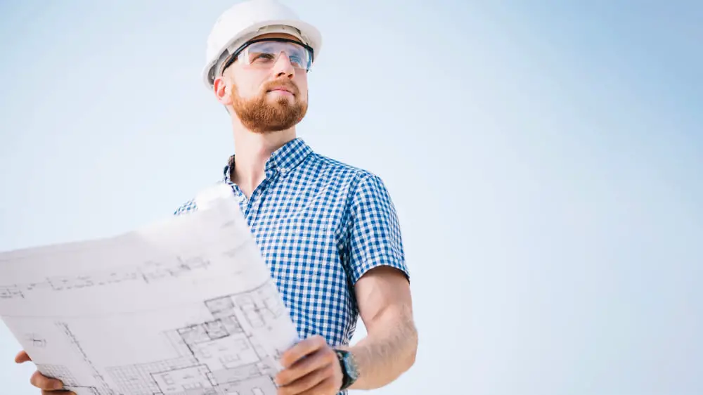 man holding blueprint