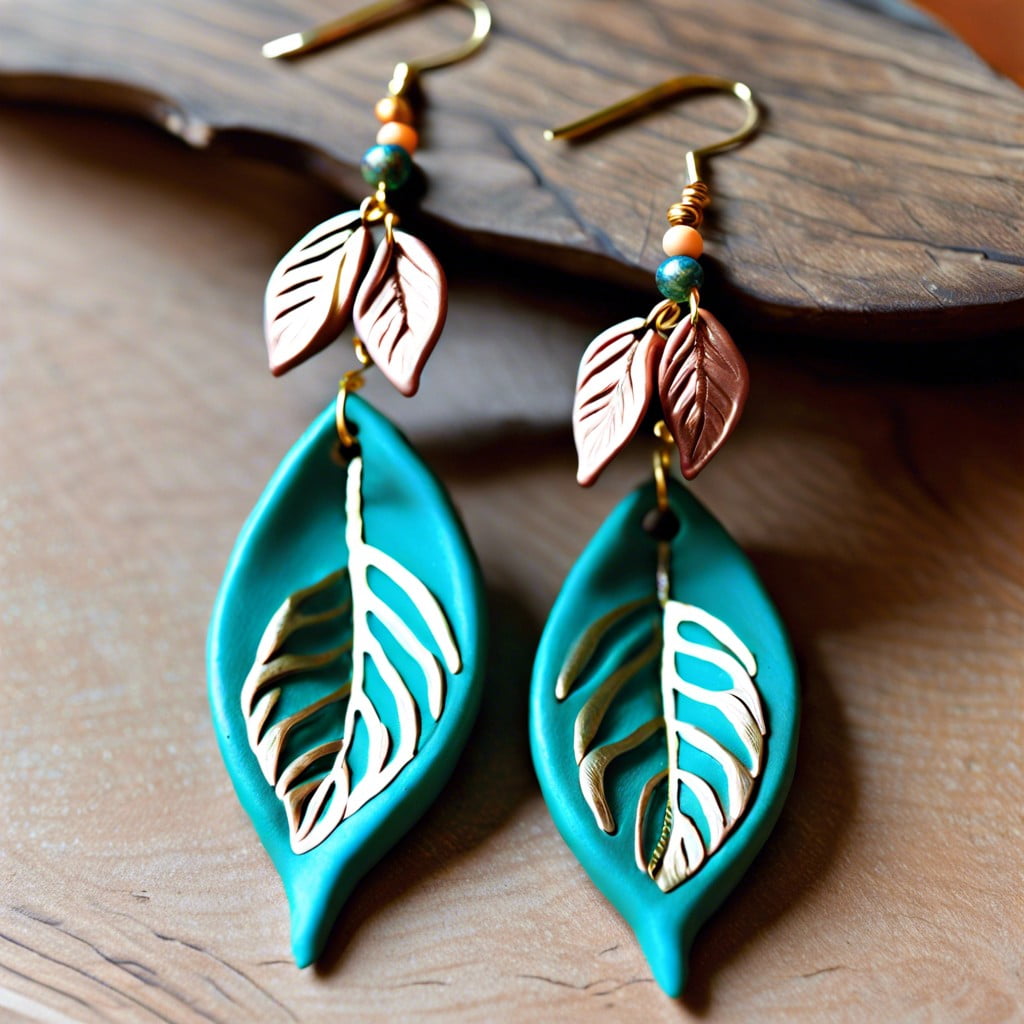 metallic leaf accents on clay earrings